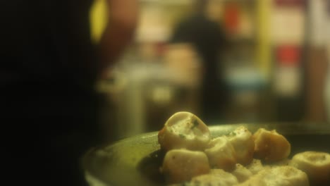 pan-fried dumplings in a kitchen