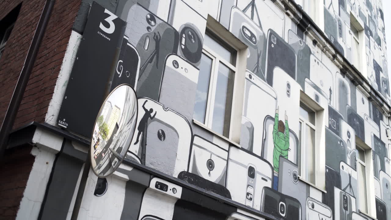 Building Mural Featuring Many Smartphones and People