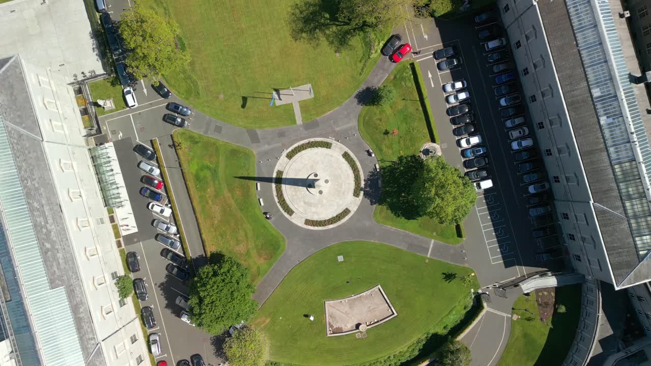 Overhead rising aerial video of the gardens at Seanad Éireann in Dublin City Centre, Ireland on a sunny day. Filmed in 4K, 60FPS with Rec709 Color.