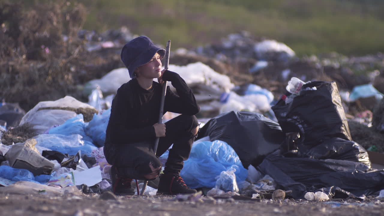 Young person in a landfill