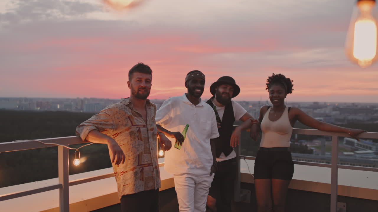 Happy People Posing on Rooftop Terrace on Summer Evening