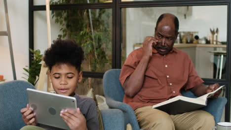 black man and boy in the living room