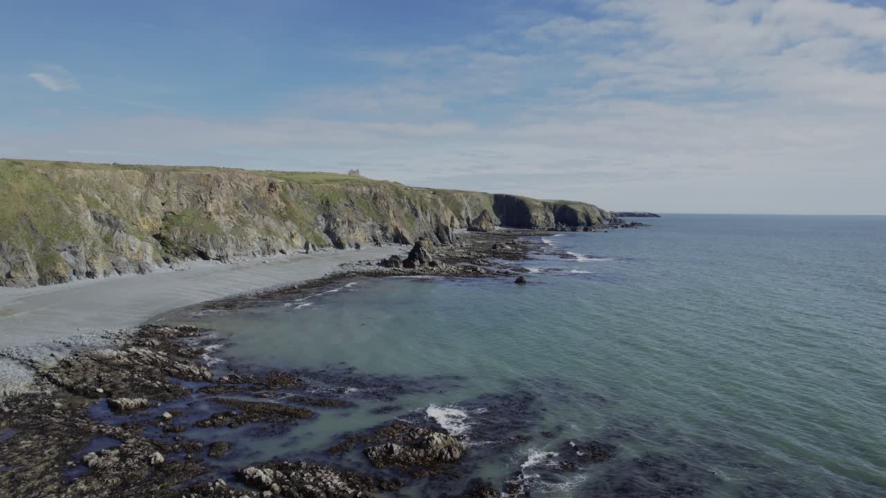 Ireland Epic Locations calm seas rocky shoreline and sea cliffs Copper Coast Waterford Ireland dramatic coastlines