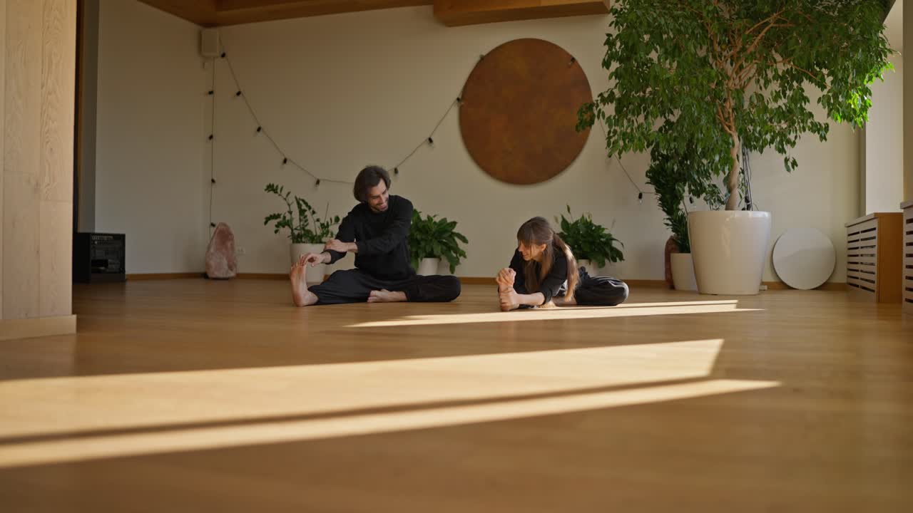 People Doing Yoga and Stretching in Studio