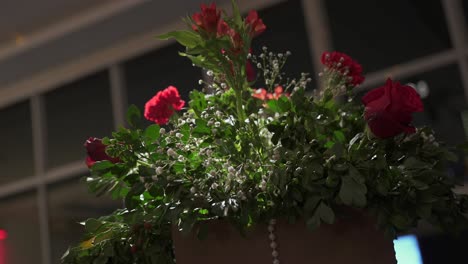 bouquet of red roses with white flowers and green leaves