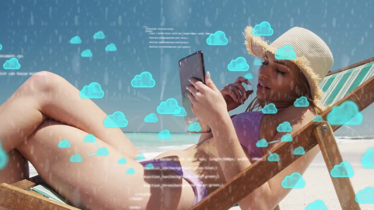 Woman lying beach chair tapping tablet cloud icons and code rising obscuring then revealing IT data