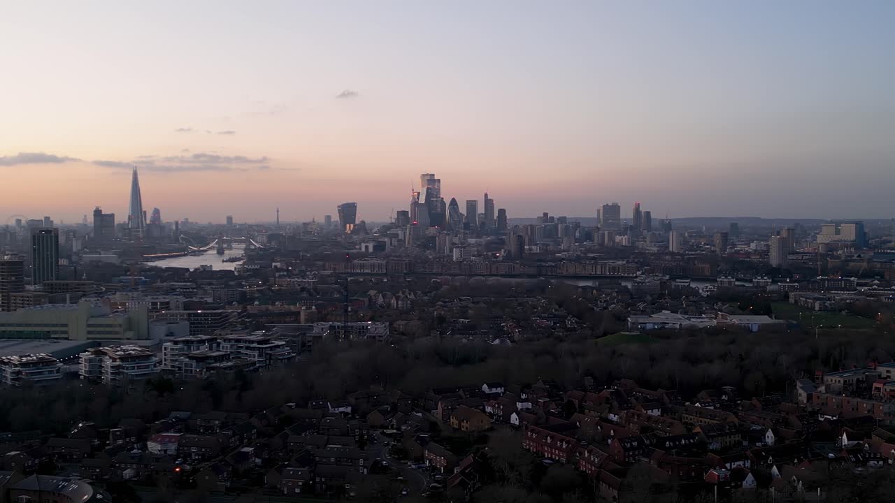 London's skyline at sunset, showcasing iconic landmarks and buildings, aerial view