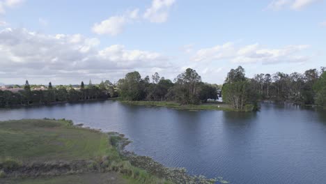 Scenic-Mudgeeraba-Creek-In-The-Gold-Coast-Hinterland-Of-Queensland,-Australia,-Surrounded-By-Lush-Scenery-At-Daytime