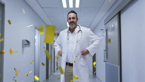 in hospital, doctor standing with falling golden confetti in hallway