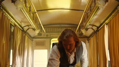 a man in a vintage train car