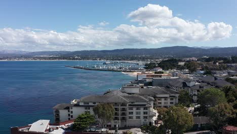 super wide aerial shot of the old fisherman's wharf and monterey bay from cannery row in monterey, california