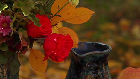 thanksgiving flowers in vase on table outside in garden