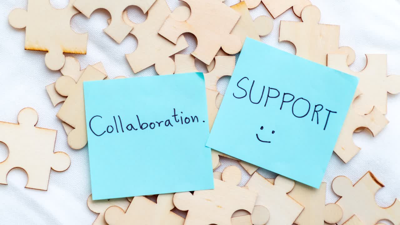 A close-up of puzzle pieces symbolizes collaboration and support in a creative workspace.