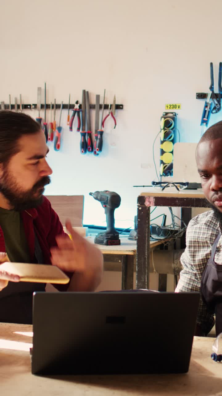 Two Woodworkers Discussing Design of a Wooden Bowl in Workshop