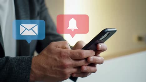 closeup of a man's hands typing a message on a smartphone