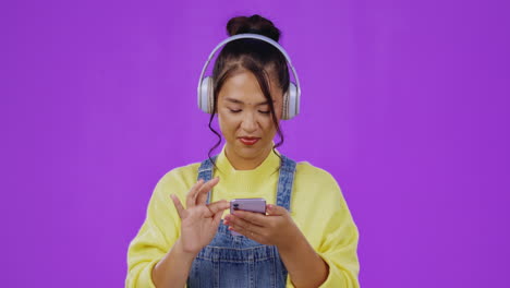 scrolling, music and phone with asian woman