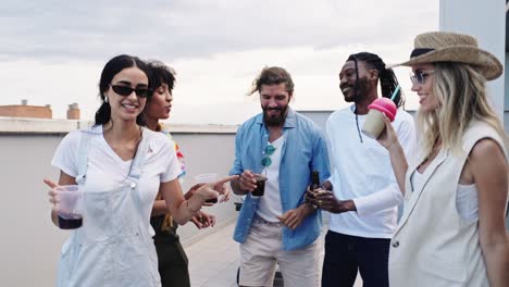 group of friends toasting on a rooftop