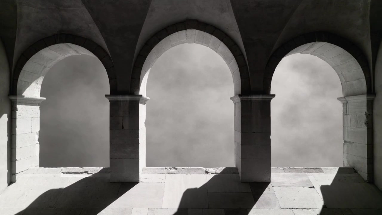 Clouds drifting causing sunlight shifting diagonal shadows across floor at stone arcade, arches