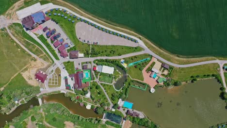 modern resting zone. panoramic view of a recreation complex surrounded by beautiful nature in summer. aerial view. camera moving around.