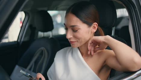 rich businesswoman recording audio message on smartphone sitting car close up.