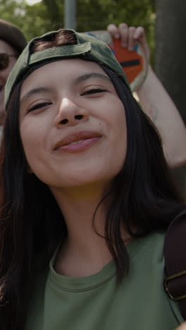 smiling young woman in green cap