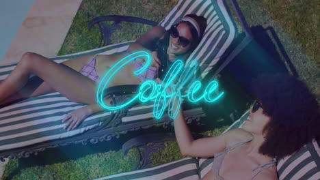 two friends clinking beer bottles on lounge chairs, showing neon-blue coffee sign for marketing