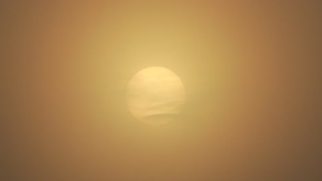sunrise during cloudy foggy morning, sun behind clouds close up, maffra, gippsland, victoria, australia