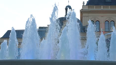 Fountain-in-front-of-an-old-building-in-Austria