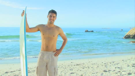 Handsome-man-running-with-his-surfboard