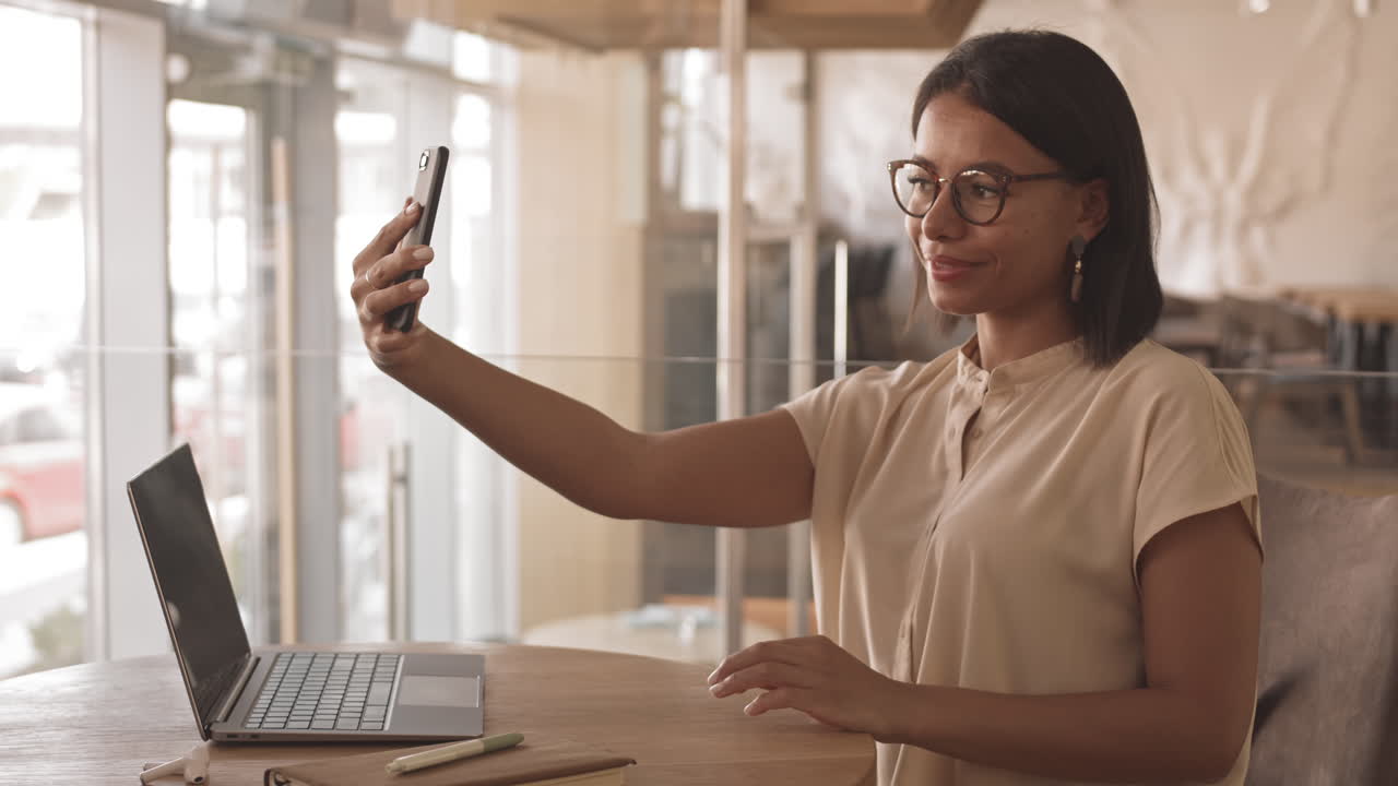 Mixed-Race Freelancer Taking Selfie