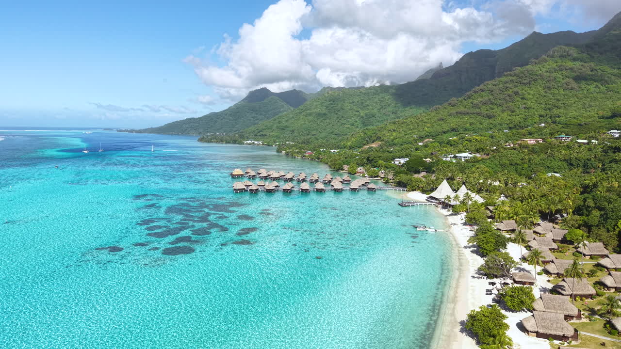 Moorea Island, French Polynesia. Drone Shot of Coastline, Resort With Overwater Bungalows and Lagoon