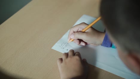 child writing family members