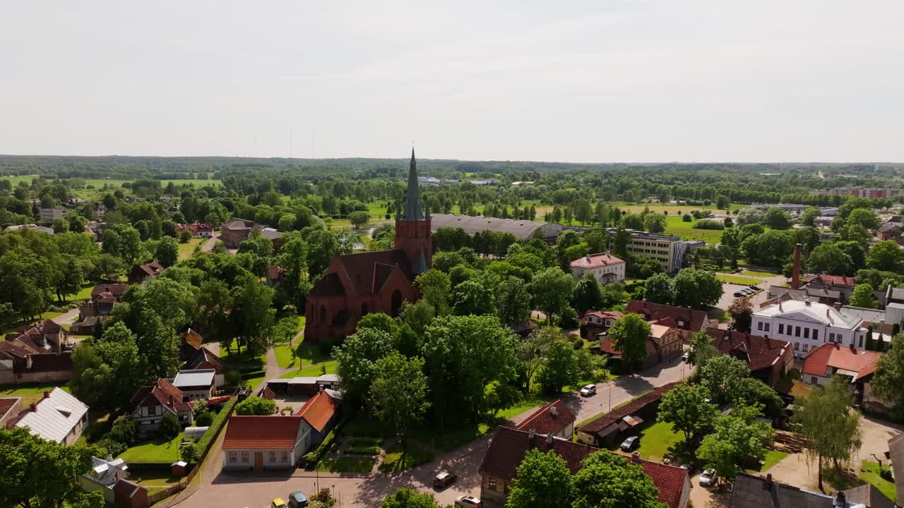 Aerial Orbit, Kuldiga Latvia Highlighting St Anna Lutheran Church And Old Town