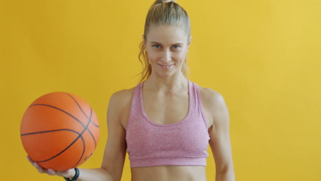 woman holding a basketball