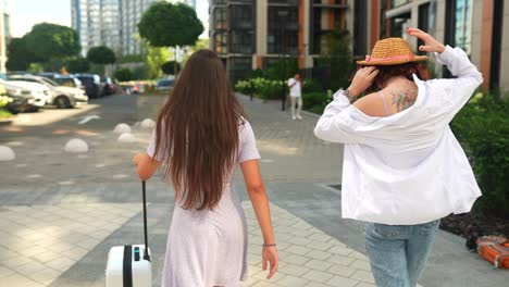 two women traveling in the city