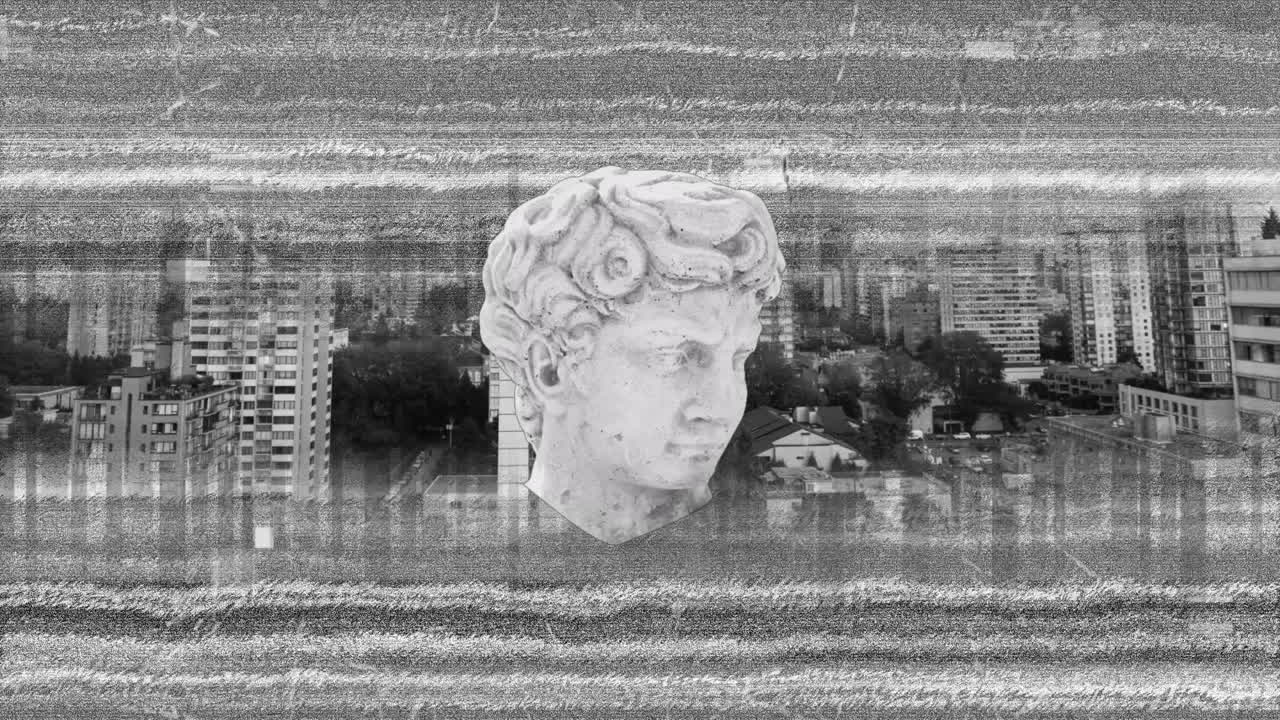 회색의 고통스러운 배경 위에 고대 머리 조각의 애니메이션