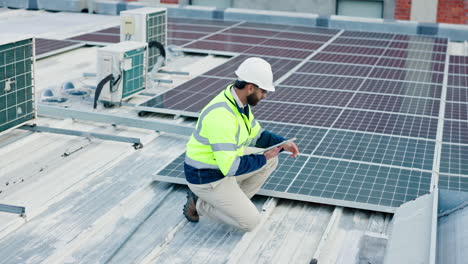 technician inspecting solar panels on a rooftop