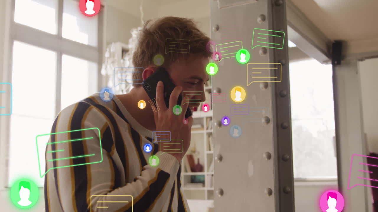 Man holding smartphone to ear in business loft office, showing animated chat bubbles and user icons