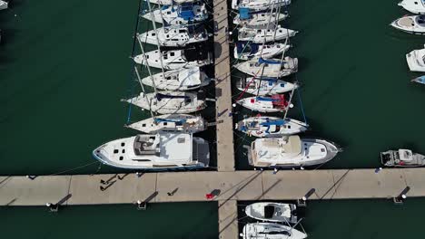 aerial view of boats and yachts docked in a sunny marina