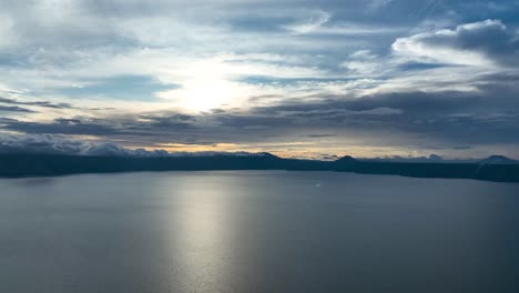 surface of lake toba, sunset creates mesmerising play of light and shadow