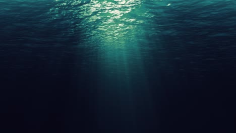 seamless loop of deep blue and green ocean waves from underwater background, light rays shining through