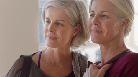 portrait beautiful old women twin sisters enjoying yoga class smiling happy middle aged siblings practice healthy fitness lifestyle in workout studio