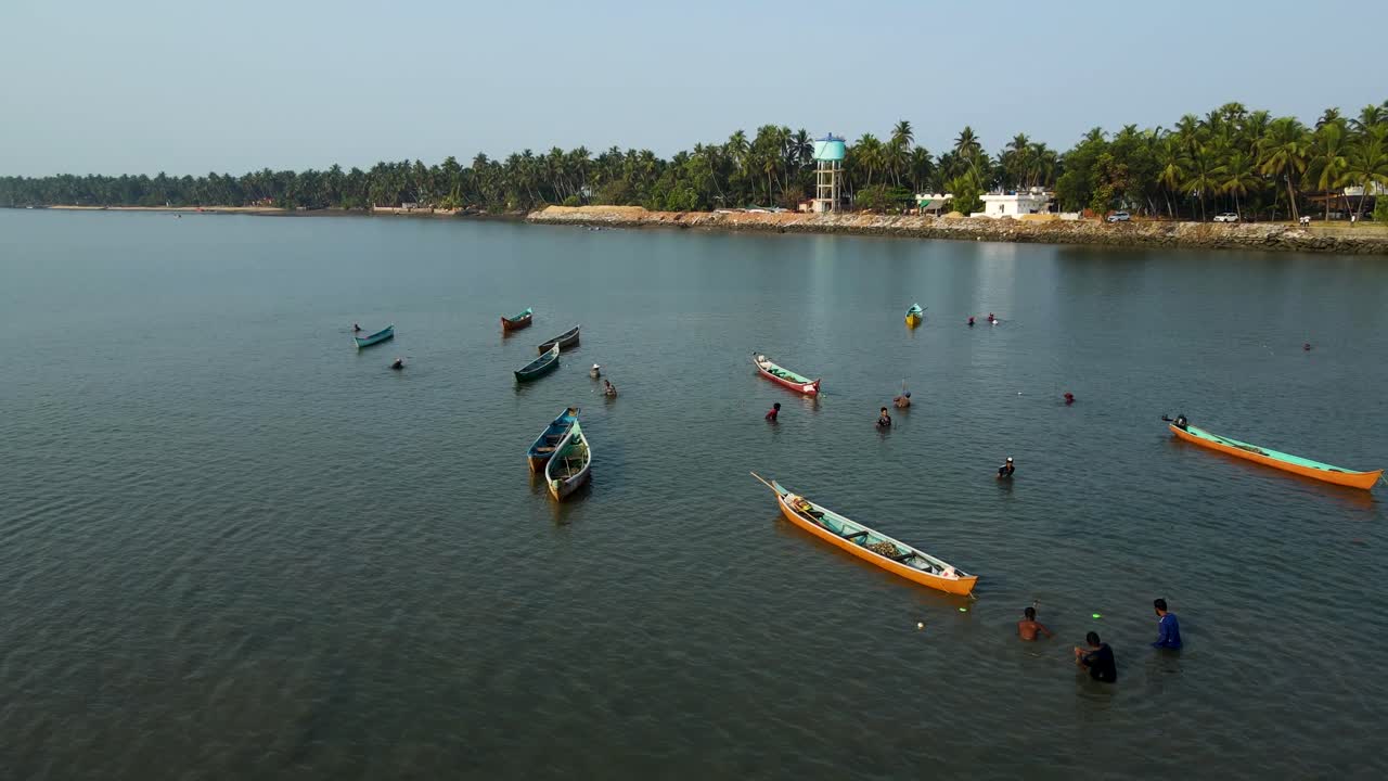 Aerial Drone Shot of Fishermen Navigating the Ocean Near Udupi
