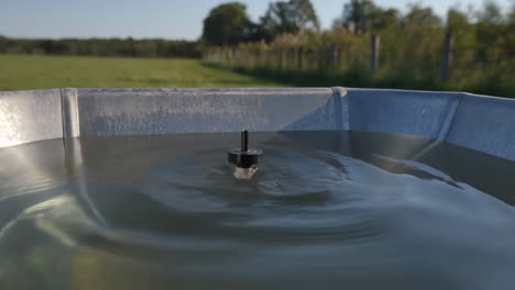 water in a tank in a field