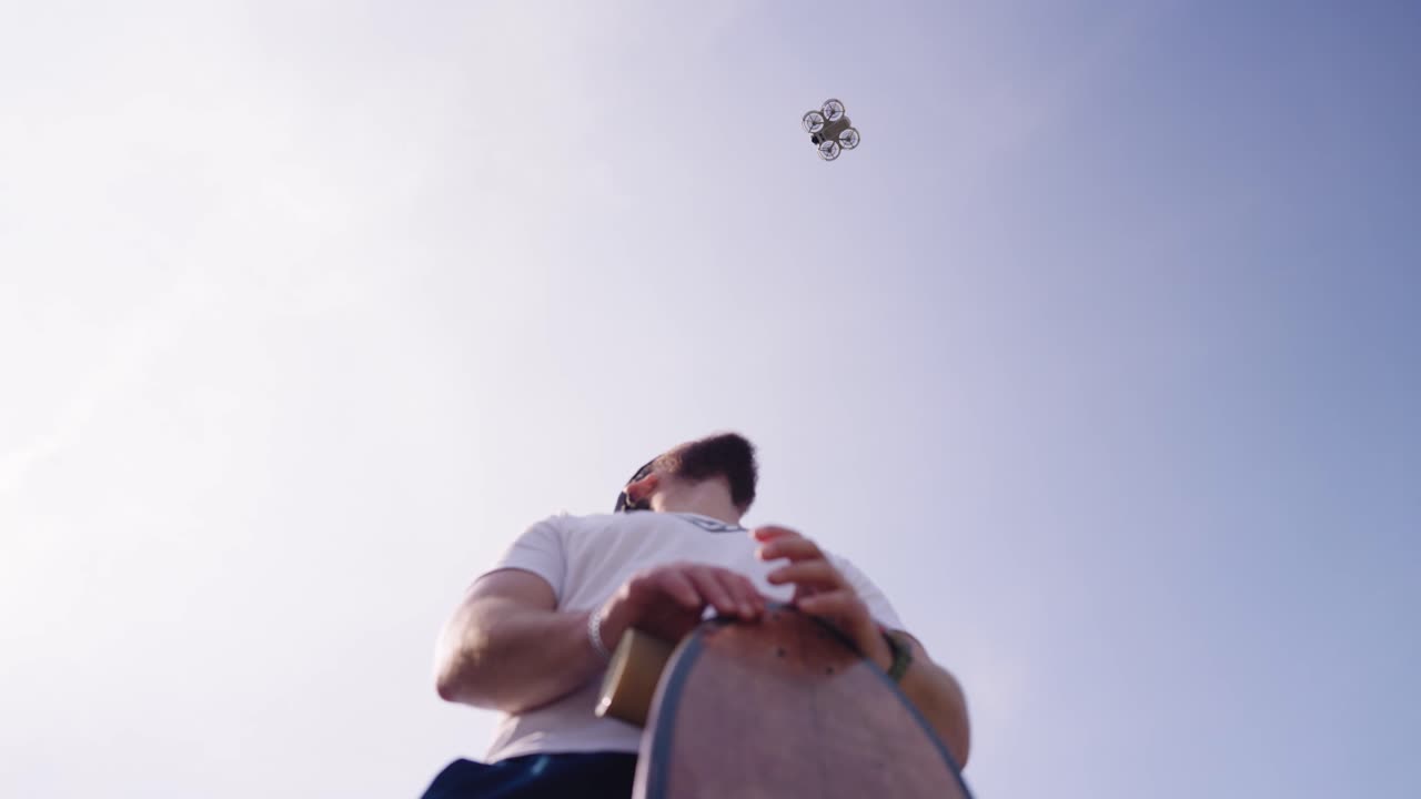 Low angle view of male catch compact drone on outstretched hand, Czechia