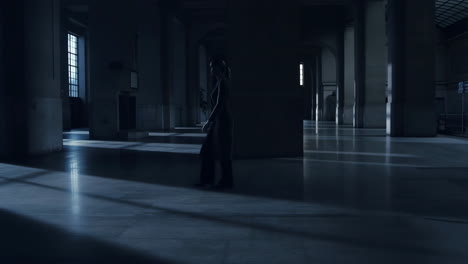 woman in a dark hall