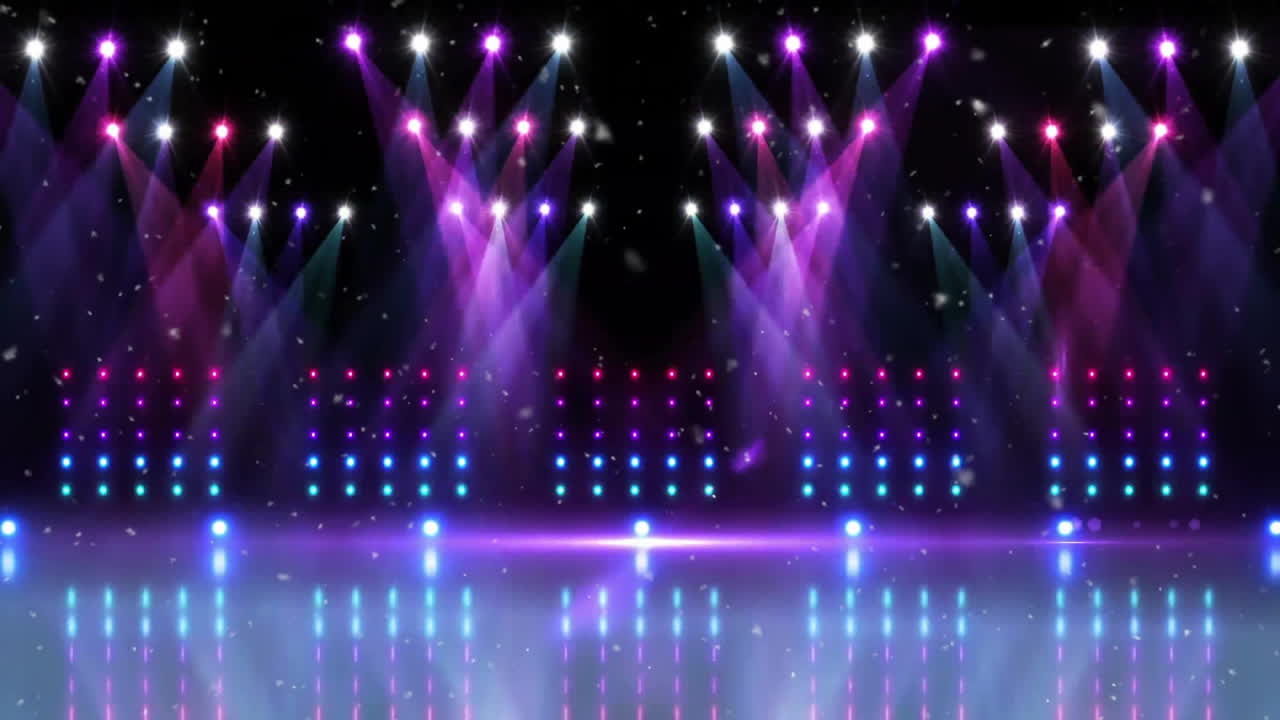 Animation of snow falling over purple and pink spotlights and banks of lights over empty stage