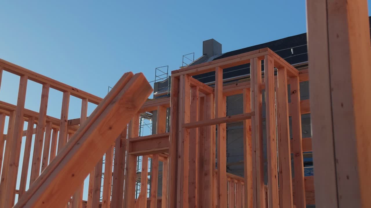 Smooth lateral move through timber framing with building exterior behind