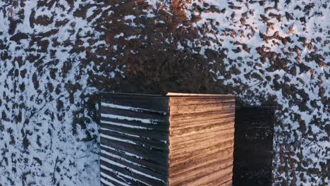 wooden roof of cottage in snowscape terrain near podczerwone village in poland