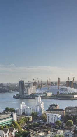 timelapse of the skyline of canary wharf, london docklands, london england in vertical